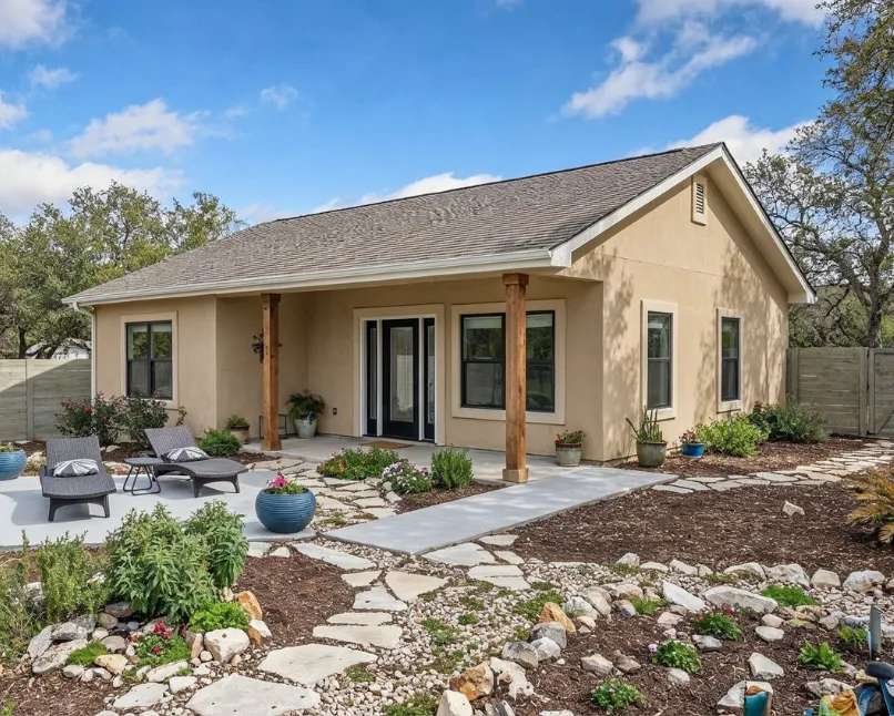 Detached backyard cottage style ADU built in Los Angeles with covered patio, modern windows, and custom landscaping by ADU construction experts