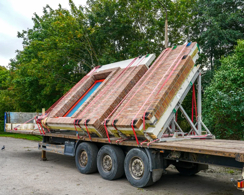 Prefabricated ADU module transported on trailer for installation in Los Angeles residential property